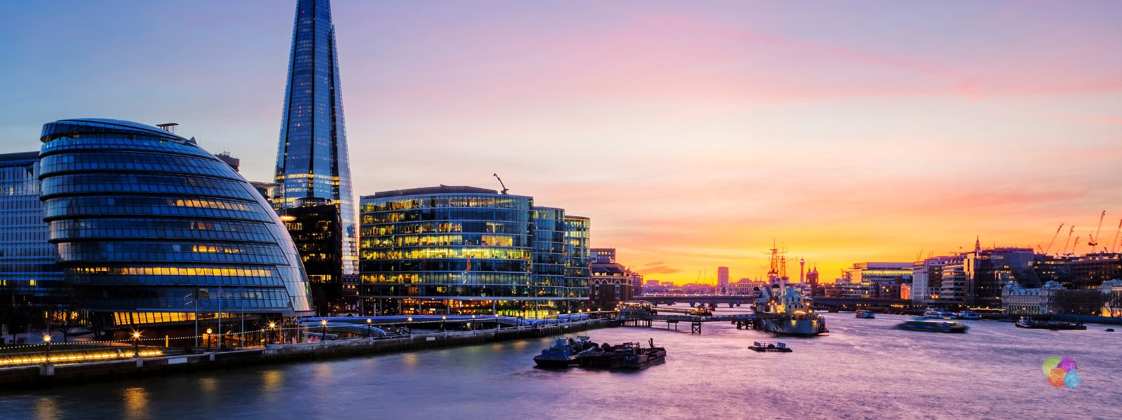 London skyline at dusk — the Shard and City Hall on the River Thames